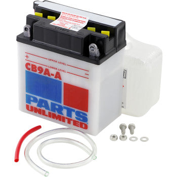 The Battery YB9A A by Parts Unlimited is a white heavy-duty battery with red, blue, and gray text. It comes with a clear tube, red tube, screws, washers, and a plastic packet—built for reliable cranking power. Shown on a white background.