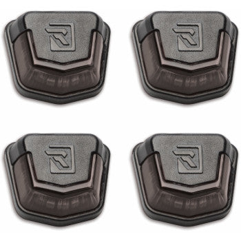 Set of four black plastic Can Am Defender trunk bed lights with raised R logo on top and curved design.