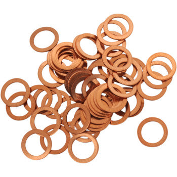 A pile of Drain Plug Washers M10 by Bolt scattered on a white background, commonly used along with aluminum washers during oil changes.