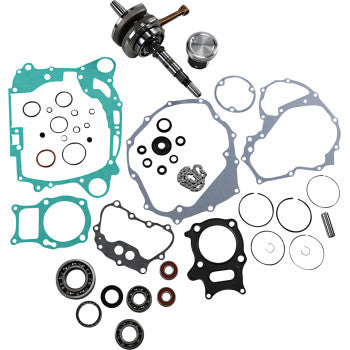 Honda engine rebuild kit with metal crankshaft, piston, various green and gray gaskets, black rubber seals, and metal rings.