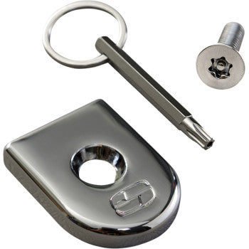 The Security Seat Screw - Chrome by Saddlemen features a chrome lock set with a flat key, metal ring, and shiny rectangular cover with a central hole.