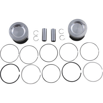 Two silver metallic pistons with flat tops, two cylindrical wrist pins, four small retaining clips, and eight assorted.
