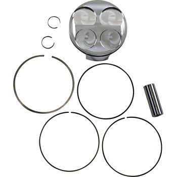 Four silver metal pistons with valve recesses, three black piston rings, two small clip rings, and one cylindrical wrist pin