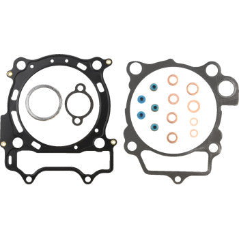 The Yamaha Top End Gasket Kit 98 mm by Cometic includes two black MLS head gaskets with circular and oval cutouts, copper washers, and blue-tipped seals—ideal for top-end rebuilds with extreme sealing performance.