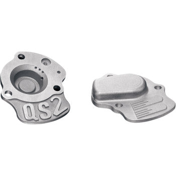 Two silver metal Boyesen Quickshot 2 Accelerator Pump Covers for Polaris, Honda, Yamaha, Kawasaki, and Suzuki are shown on a white background. The left has “QS2” engraved with multiple holes; the right is smooth with three parallel lines.