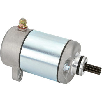 The Honda Starter by Rick's Motorsport Electric is a cylindrical metal aftermarket starter with a shiny silver body, electrical terminal on top, mounting bracket, and gear; it features longer-life bearings for enhanced durability.