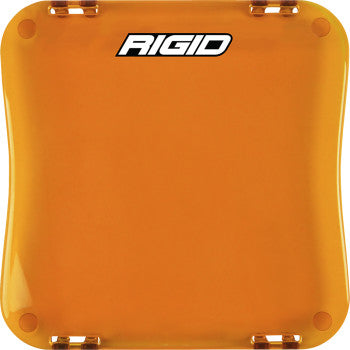 The Light Cover D-XL Series Amber by Rigid Industries is a square, amber polycarbonate lens cover with rounded corners and RIGID in bold white at the top. Four corner clips provide extra protection and a secure snap-on fit.