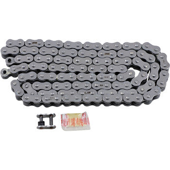 The 520 Max Z Drive Chain 120 Links Chrome by RK is coiled on a white surface with a master link and lubricant packet—perfect for high-performance street bikes.