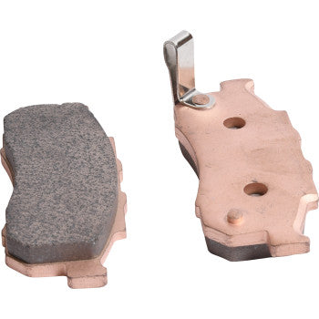 Two Sintered Brake Pads by All Balls are shown: one highlights its textured friction surface, while the other reveals a smooth copper-colored backing plate and metal clip—engineered for excellent stopping power and long-lasting performance.