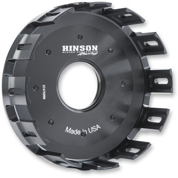 The Clutch Basket by Hinson Racing is crafted from race-proven billet T-6 aluminum, features a circular center opening, grooved and slotted edges, and has Made in USA engraved on its surface.