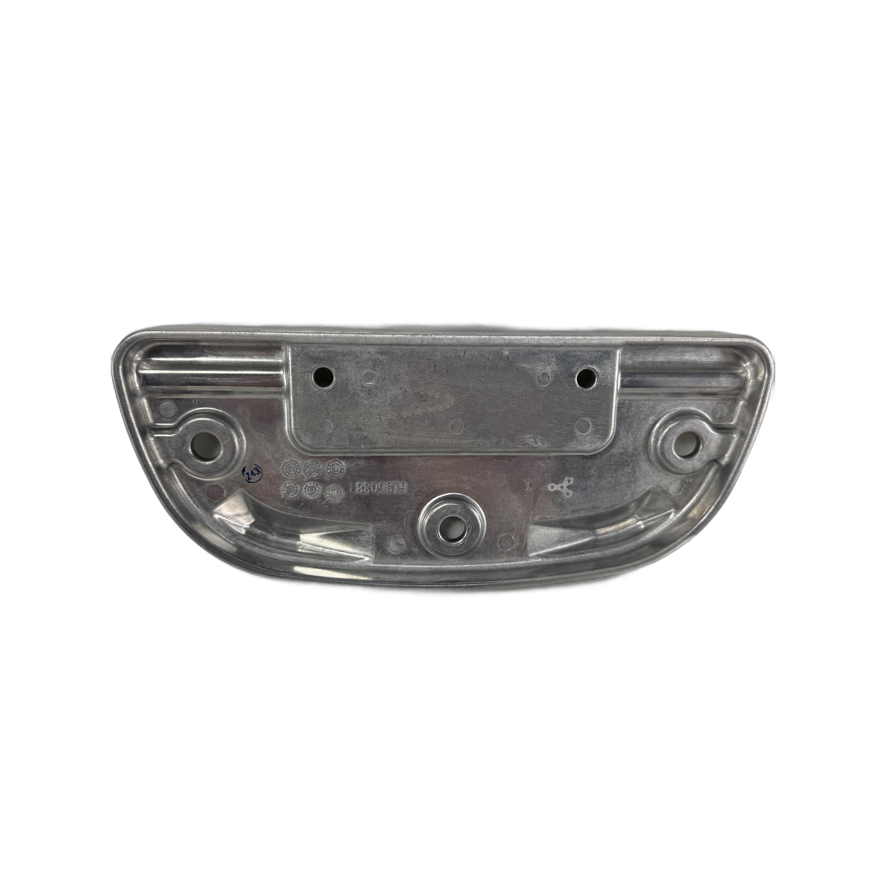 A metallic, oval-shaped Floorboard, Driver by Polaris with multiple holes and indents is shown from above on a white background, featuring a smooth finish and engraved markings that indicate it’s an OEM automotive component.