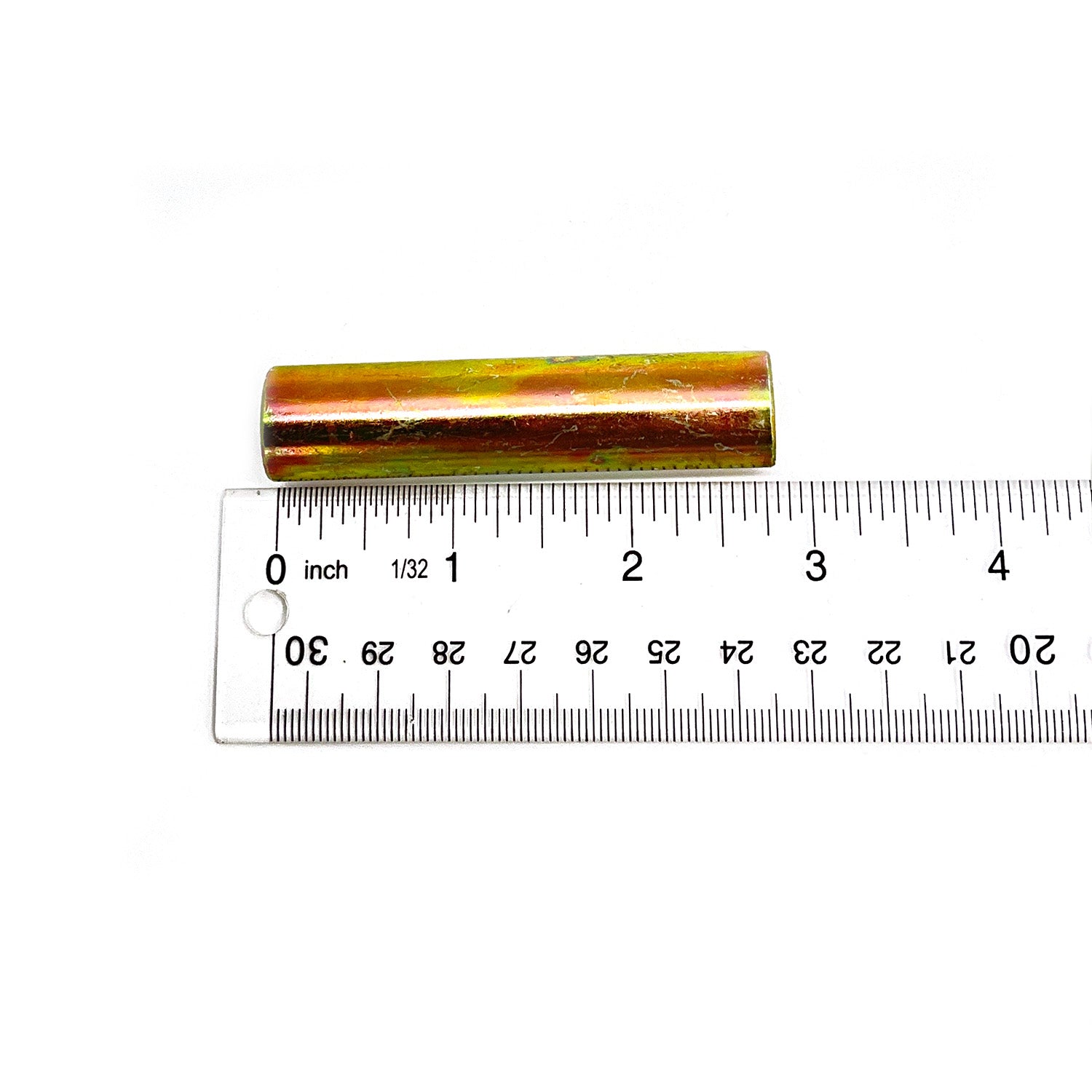 Metallic gold cylindrical pivot tube approximately 7 cm long placed next to a white ruler with black markings.