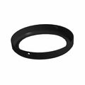 Black circular metal headlight bezel with a smooth finish and a mounting hole.