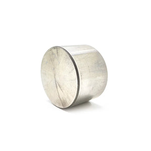Cylindrical silver metal valve tappet with polished surface and flat ends.