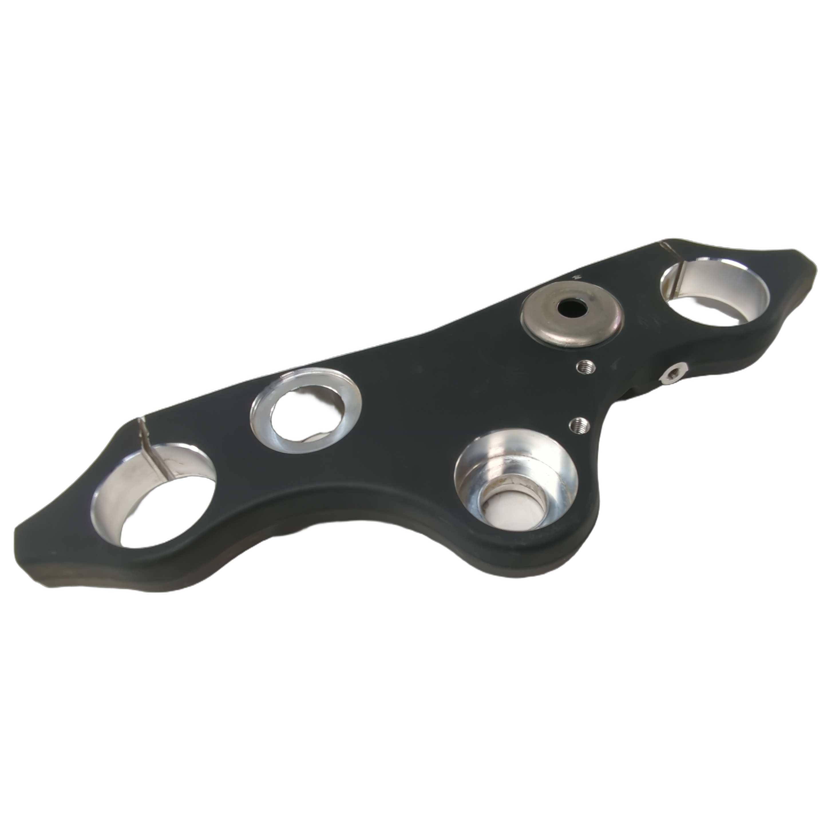 Flat black metal triple tree clamp with smooth contours and circular mounting holes.