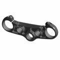 Black anodized aluminum triple tree clamp with circular openings and mounting points for Indian FTR motorcycles.