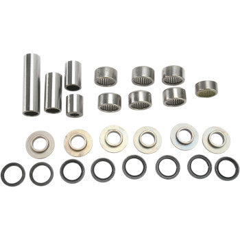 The Linkage Rebuild Kit by Pivot Works—includes metal needle roller bearings, washers, spacers, and seals—perfect for suspension control or shock bearing repairs; shown arranged in rows on a white background.