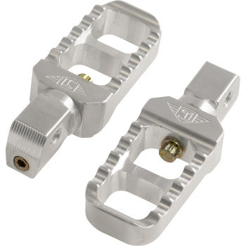 A pair of Indian Serrated Stubby Footpegs - Silver by Joker Machine with jagged edges, cutouts, and a bolt/screw attachment mechanism are shown side by side on a white background.