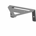 Black metal bracket with angular shape and multiple mounting holes for fuse block installation.