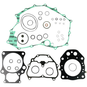 The Honda Complete Gasket Kit by Athena is displayed on a white background, featuring one green gasket with multiple holes and three uniquely shaped black gaskets—all ideal for your next engine rebuild.