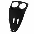 Matte black inner console panel with two large circular and two smaller oval cutouts, angular shape.