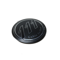 A round metal Airbox Cover Badge Darkhorse by Polaris for Indian Motorcycle, featuring "111 Cubic Inches" in silver on black with a bold 111 center—ideal as an OEM Badge-Airbox Cvr Dh replacement.