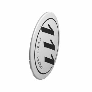 Silver and bronze oval airbox cover badge with bold black "111 cubic inches" text.