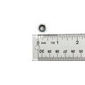 Small silver metal cylindrical door pivot bushing next to a ruler showing measurement in inches.