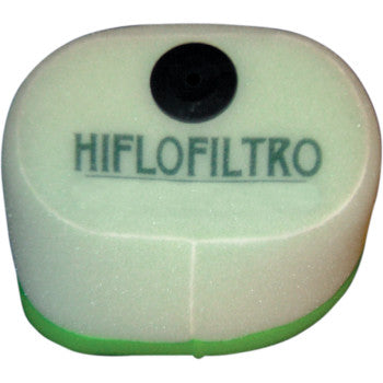 The HFF2014 Kawasaki Foam Air Filter by HiflofiSuzuki LTR o features a white and green design with bold HIFLOFILTRO branding and a black circular top, engineered for high airflow and superior filtration.