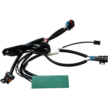 The Polaris RZR Module Run Turn Brake by Custom Dynamics is a black wiring harness with plug-and-play connectors and a green rectangular module, perfect for rear brake lights or customizing brake flash patterns.