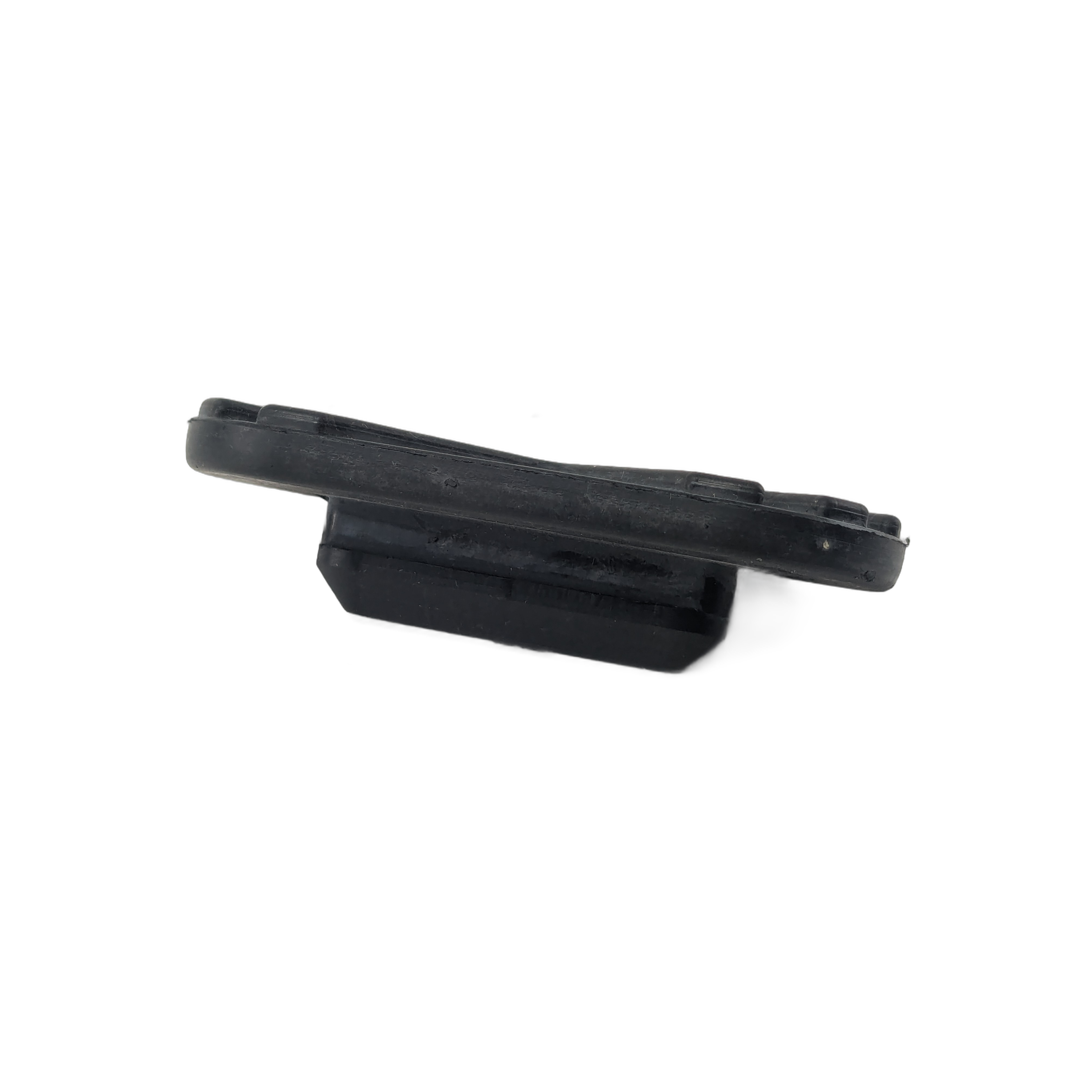 The Passenger Floorboard Pad by Polaris is a black, rectangular rubber pad with a layered, angled design—perfect as an OEM Victory Polaris or other Victory motorcycle floorboard replacement—shown on a white background.