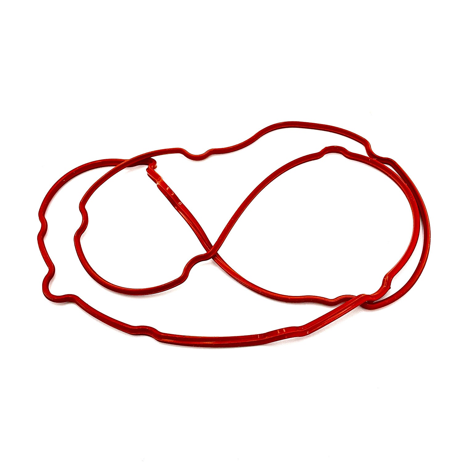 Red rubber gasket seal with irregular, tabbed shape for HVAC cover fitment.