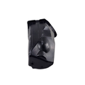A black, rectangular plastic Storage-Liner Right Hand by Polaris with angular surfaces, molded details, a circular indentation, and a small star-like symbol at one end is shown isolated on a white background—perfect as an OEM Polaris part.