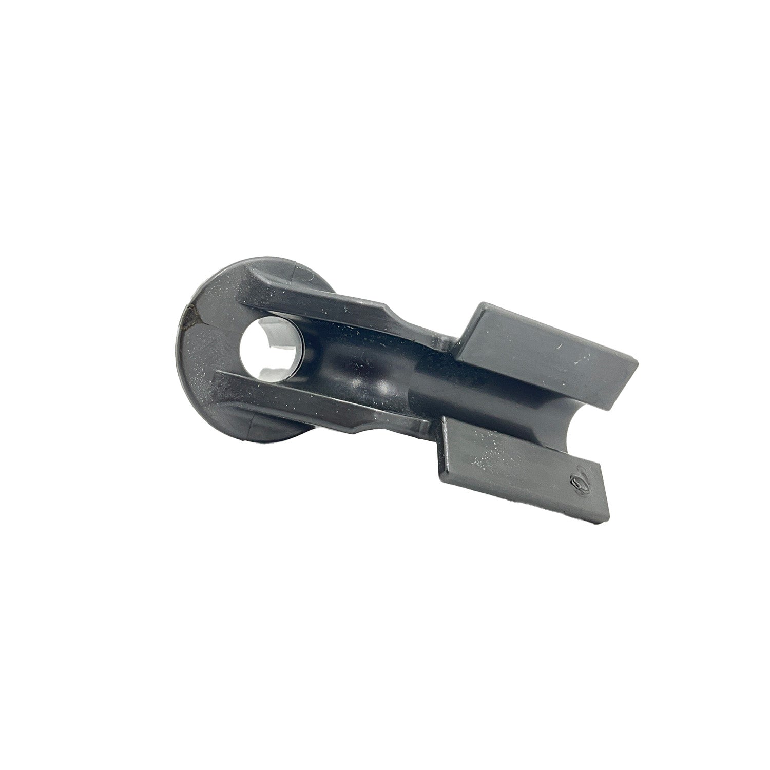 Black plastic snap linkage bushing with a cylindrical hole and forked prongs for ATV suspension use.