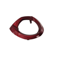 A glossy red, oval-shaped Headlight Bezel by Polaris, shown isolated on a white background.