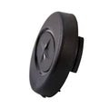 Black round plastic steering wheel cap with raised Polaris star logo in center.