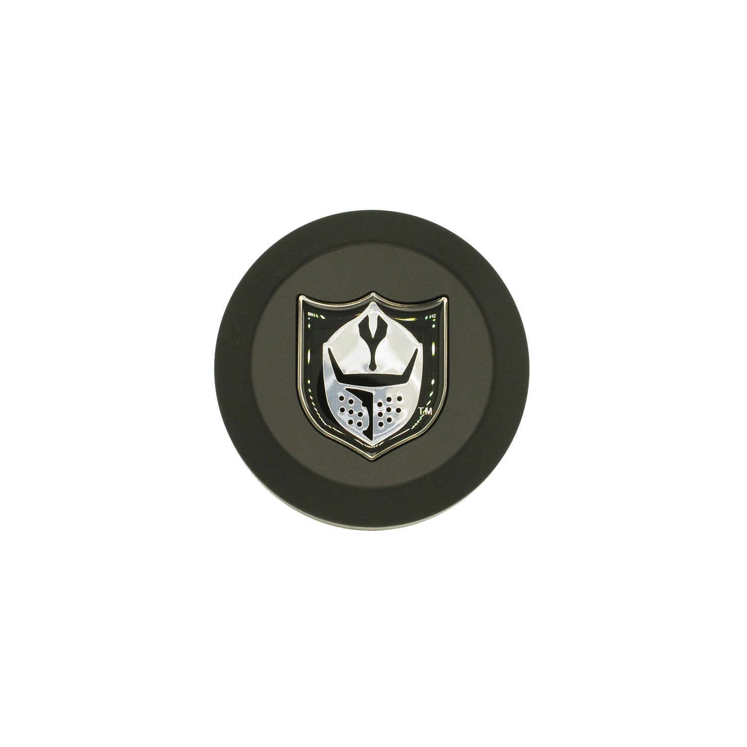 Black circular center wheel cap with silver shield emblem featuring a stylized knight helmet design.
