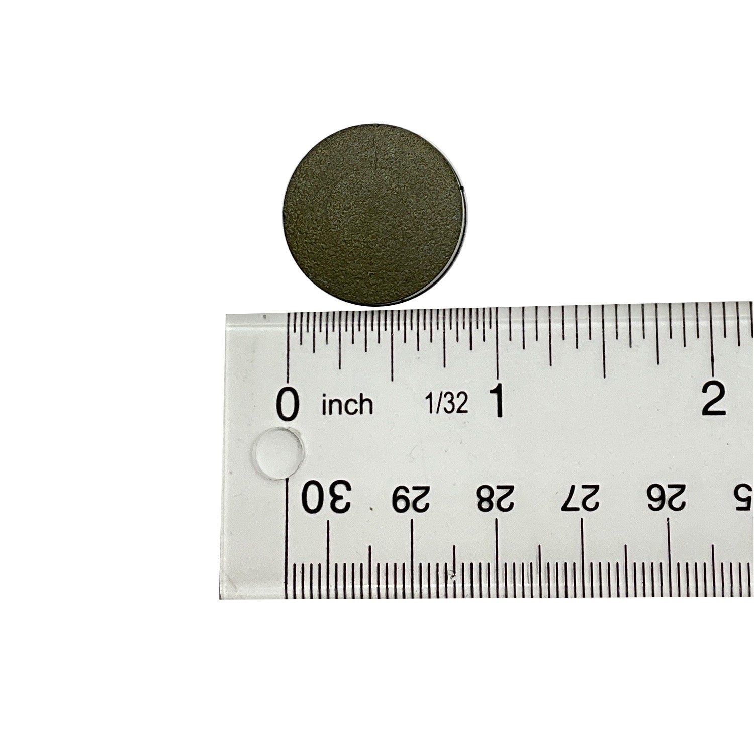 Round dark green clutch button measuring 22 mm diameter above clear plastic ruler.