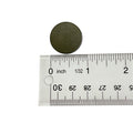 Round dark green clutch button measuring 22 mm diameter above clear plastic ruler.