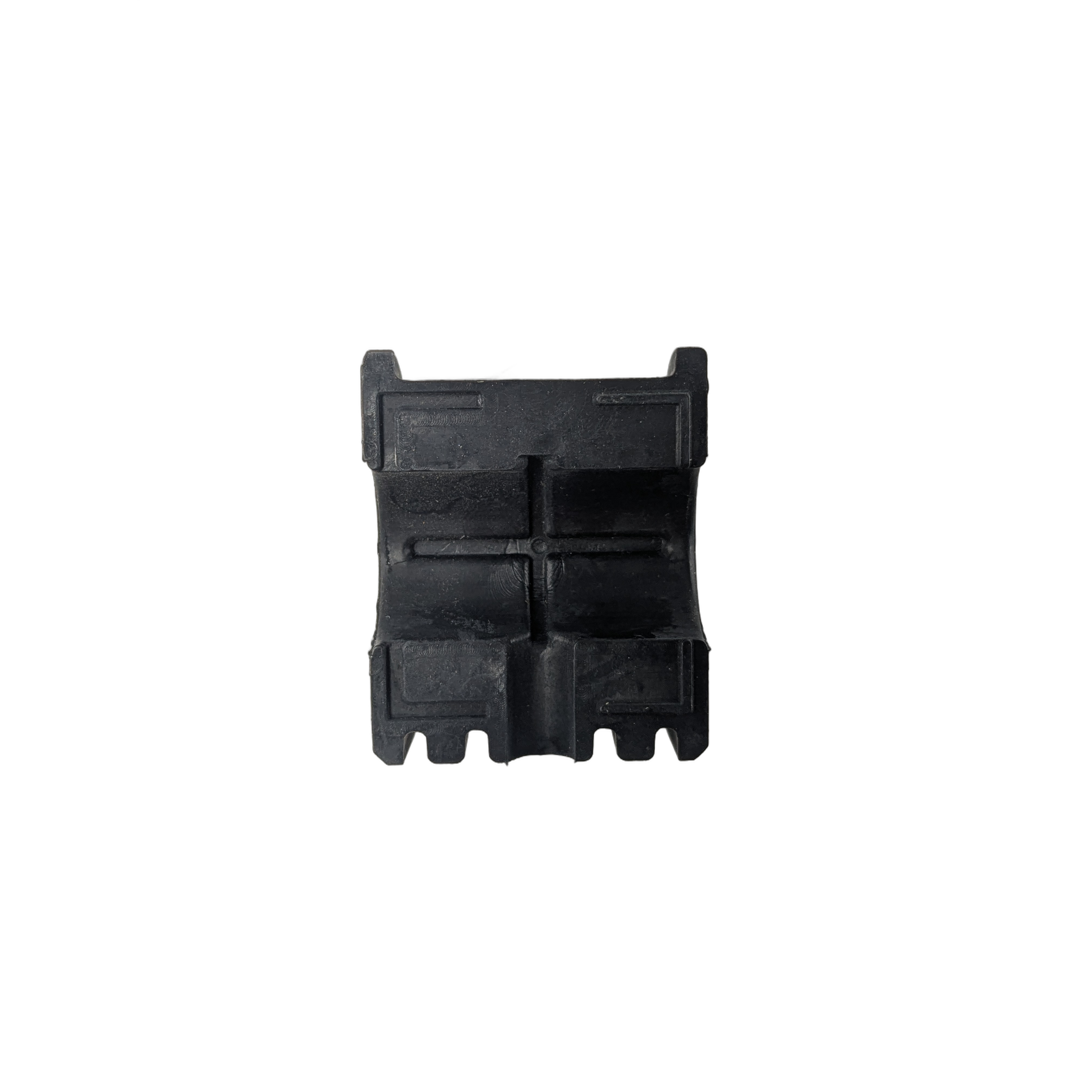 Black rectangular rubber stabilizer bar bushing with four notch grooves and a textured surface.
