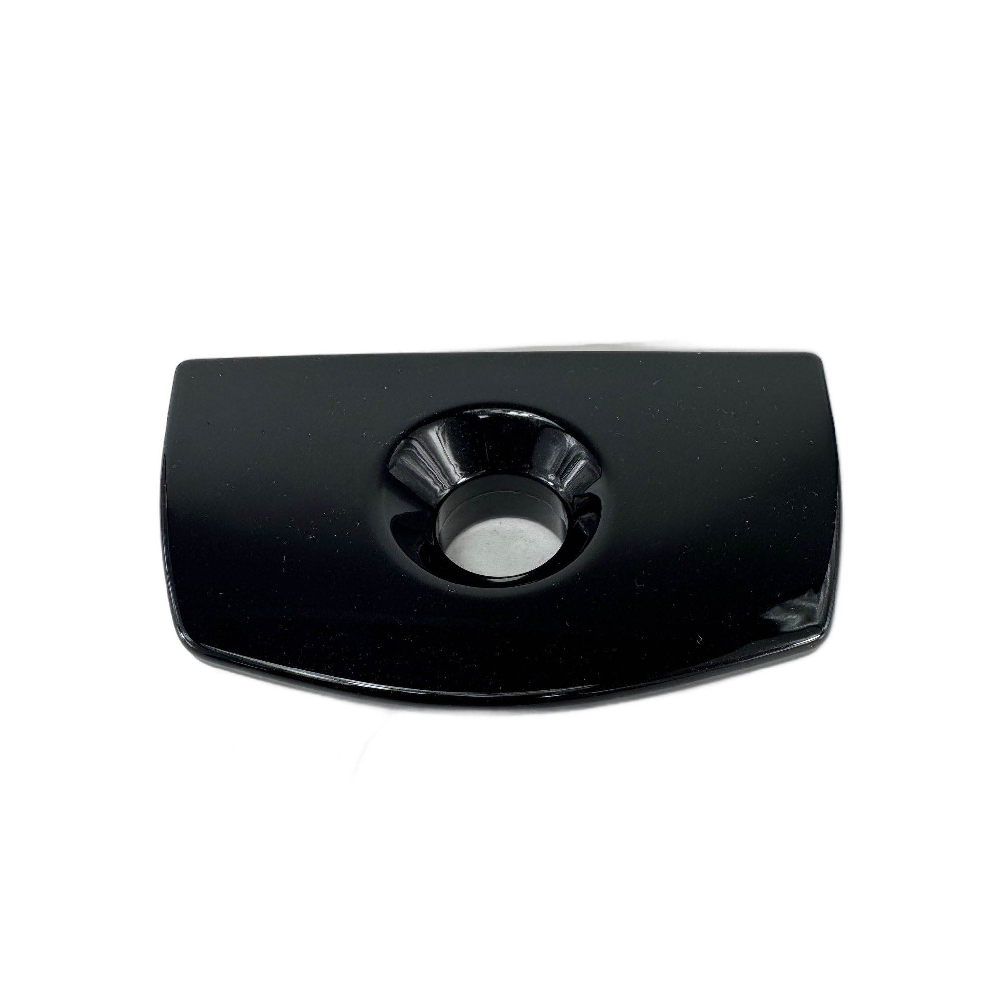 The Bezel-Lock Saddlebag LH Black Pearl by Polaris is a black, rectangular dish with curved edges and a center circular indentation, inspired by the sleek design of Indian motorcycle parts. Photographed against a white background.