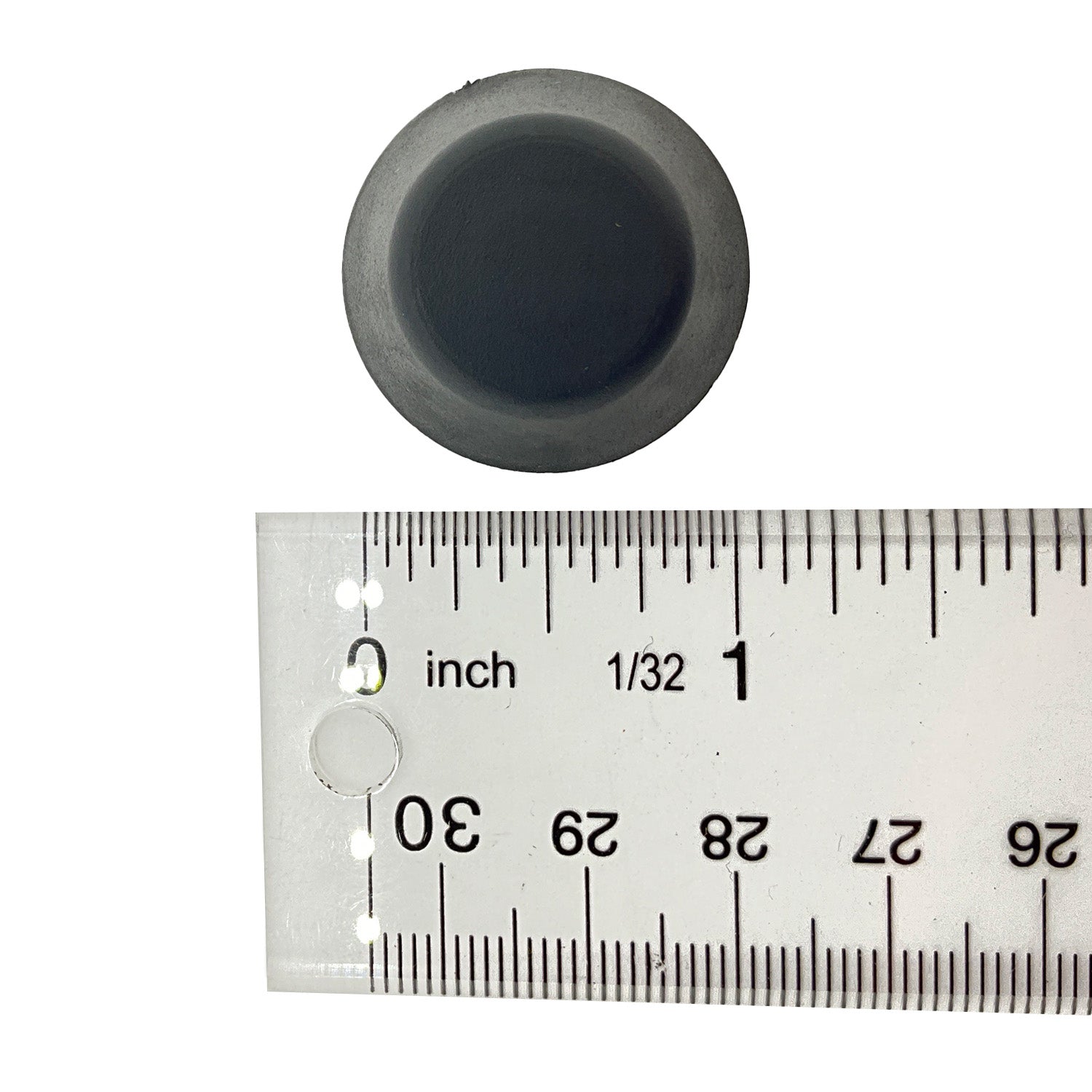 Black round cap head bolt next to a clear ruler showing diameter about 1 inch.