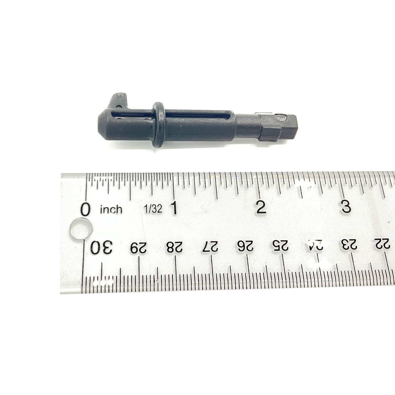Black metal quick turn pin with hexagonal end, measuring about 2.5 inches long next to metal ruler.