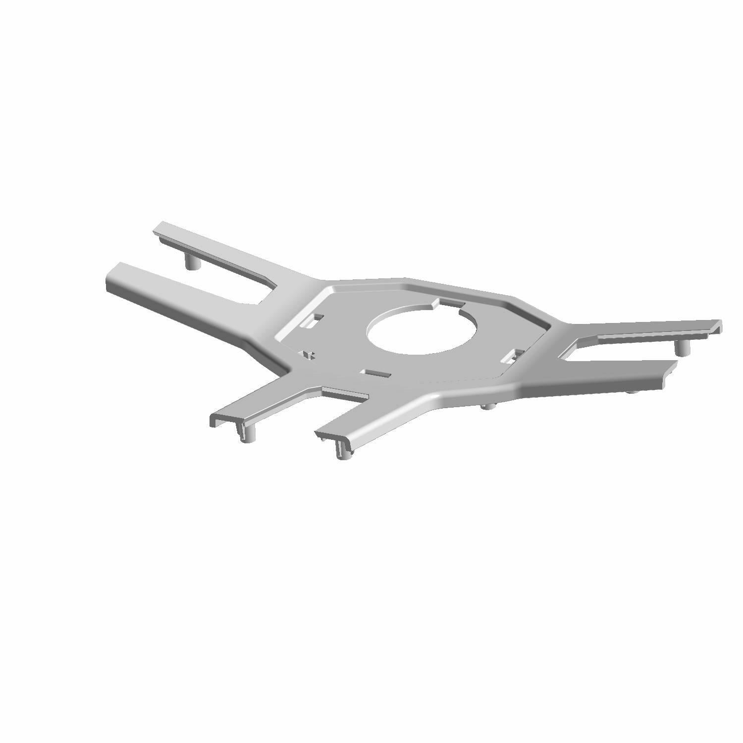 Silver metal trim piece for steering wheel with angular cutouts and central circular hole.