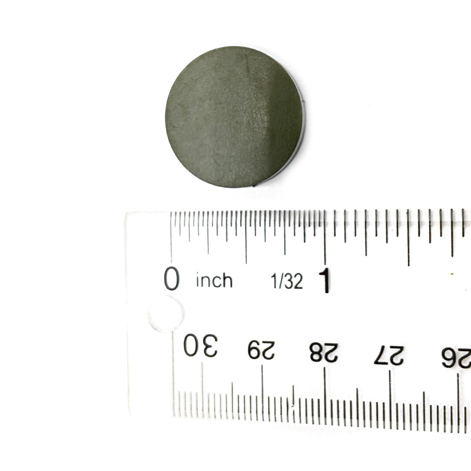 Round black clutch button with white stripe, 22 mm diameter, shown next to ruler for size reference.