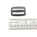 Black rectangular plastic lock ladder with ribbed center bar, shown beside a ruler for size.