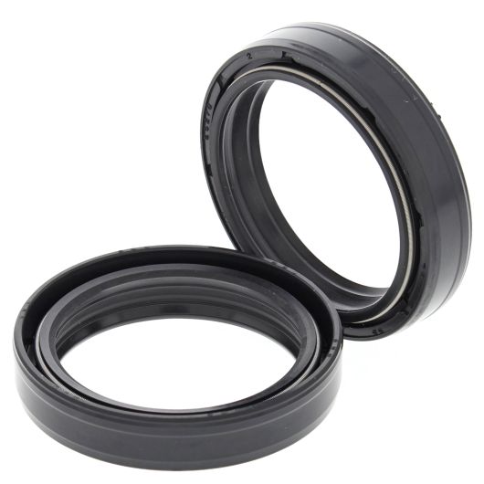 Pair of black rubber 43mm fork seals with grooved outer rings for motorcycle suspension.