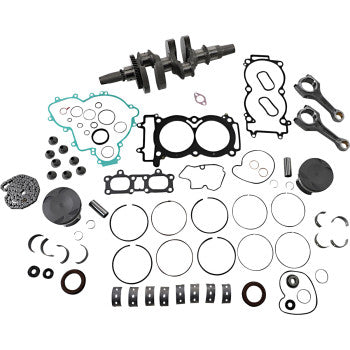 Complete Polaris engine rebuild kit with black crankshaft, multiple gaskets, pistons, rings, and small metal components.