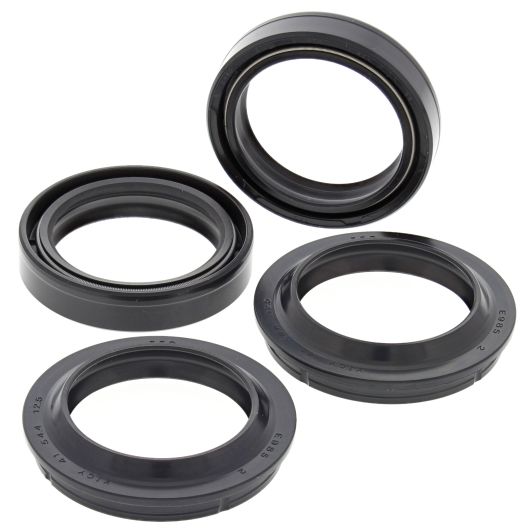 Set of four black rubber fork and dust seals, circular with smooth and ridged edges.