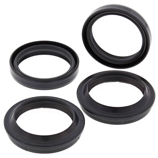 Set of four black rubber fork and dust seals in varying circular sizes for motorcycle front suspension components.